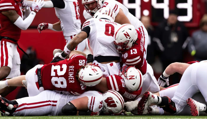 Malcolm Hartzog and Luke Reimer and Ty Robinson tackle vs Wisconsin 2022 Nebraska football